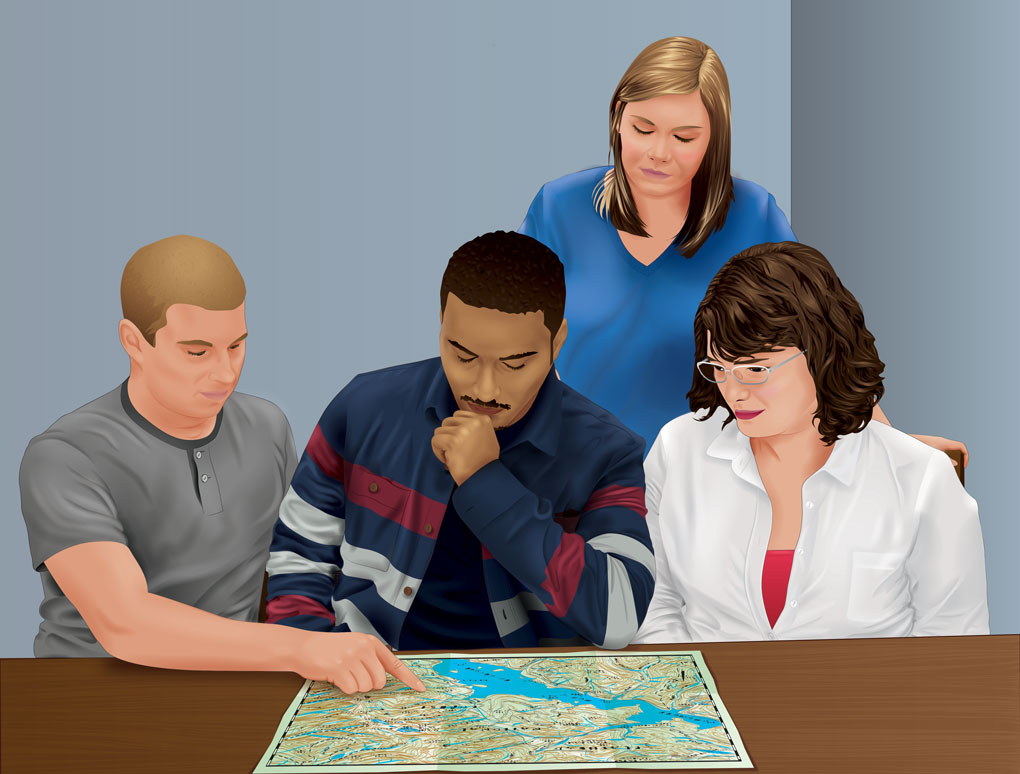 Four people looking at a map